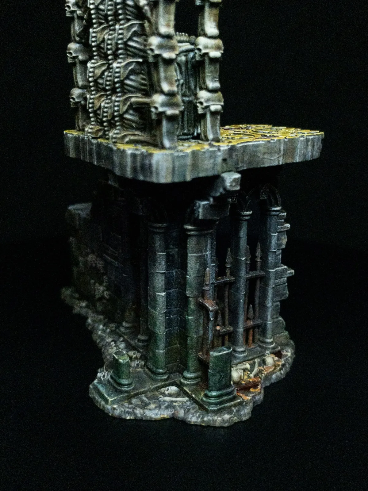 Weathered stone columns beneath the throne