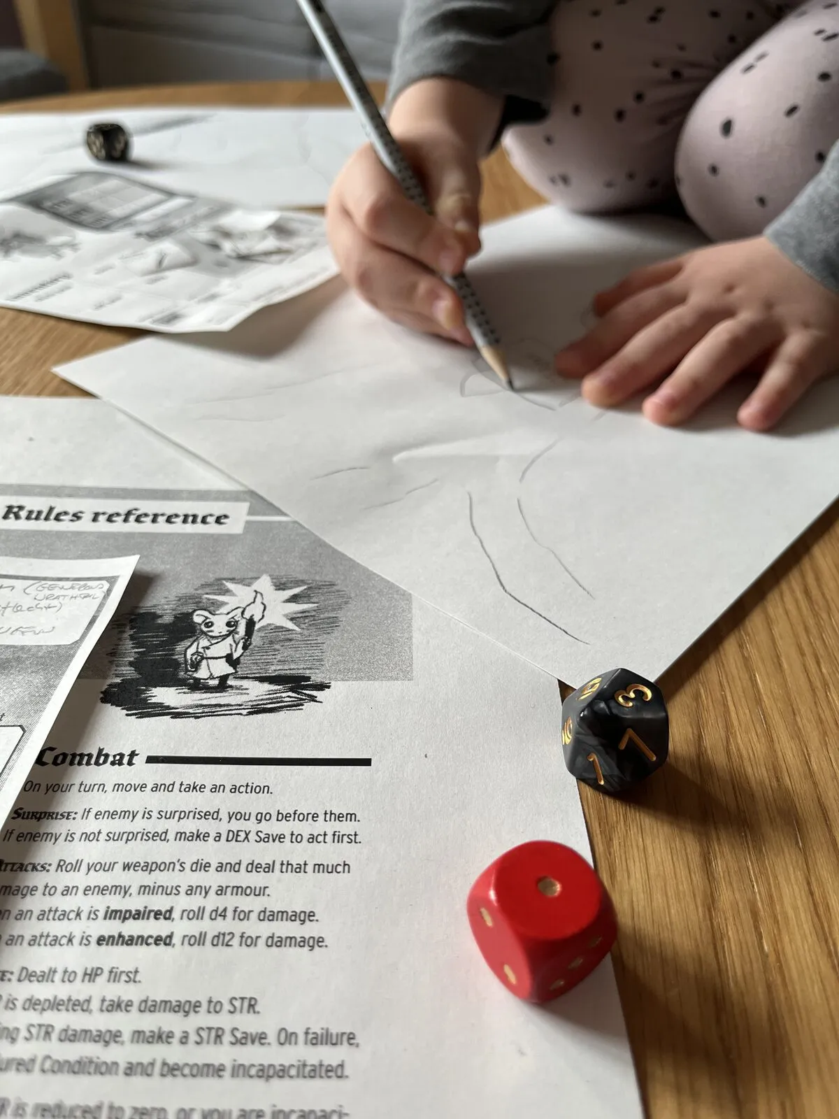 A child drawing on paper next to a pile of dice